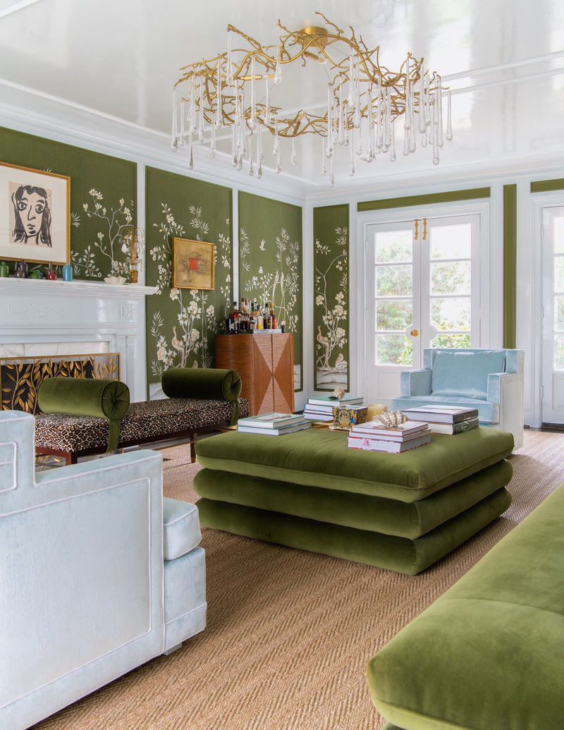 Seating area with green mohair sofa and ottoman