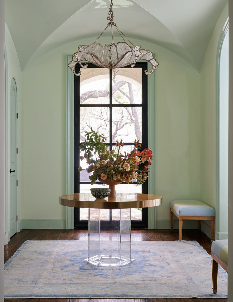 Entrance area with round table and chandelier