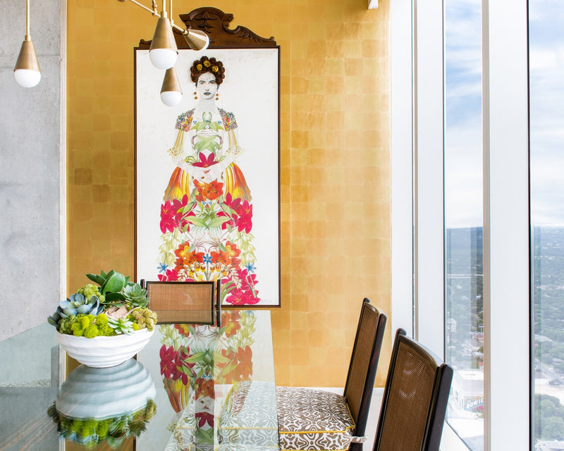 View of Frida Kahlo print on gold wall.
