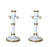 Two medium candlesticks in white and gold, fashioned like bamboo.
