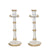 Two tall candlesticks in white and gold, fashioned like bamboo.