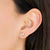 Double diamond earring in a woman's ear
